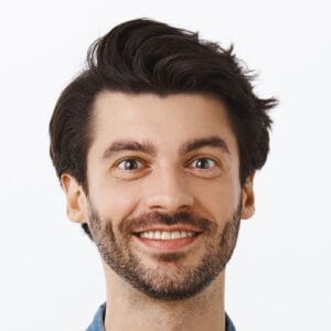 Confident, sassy young bearded gay man in pink t-shirt, shirt, hold hand on waist, pointing upper left corner and smiling, suggest friends visit party nearby, advertise product with confident look.